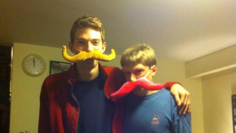 Ben and Eli wearing moustaches