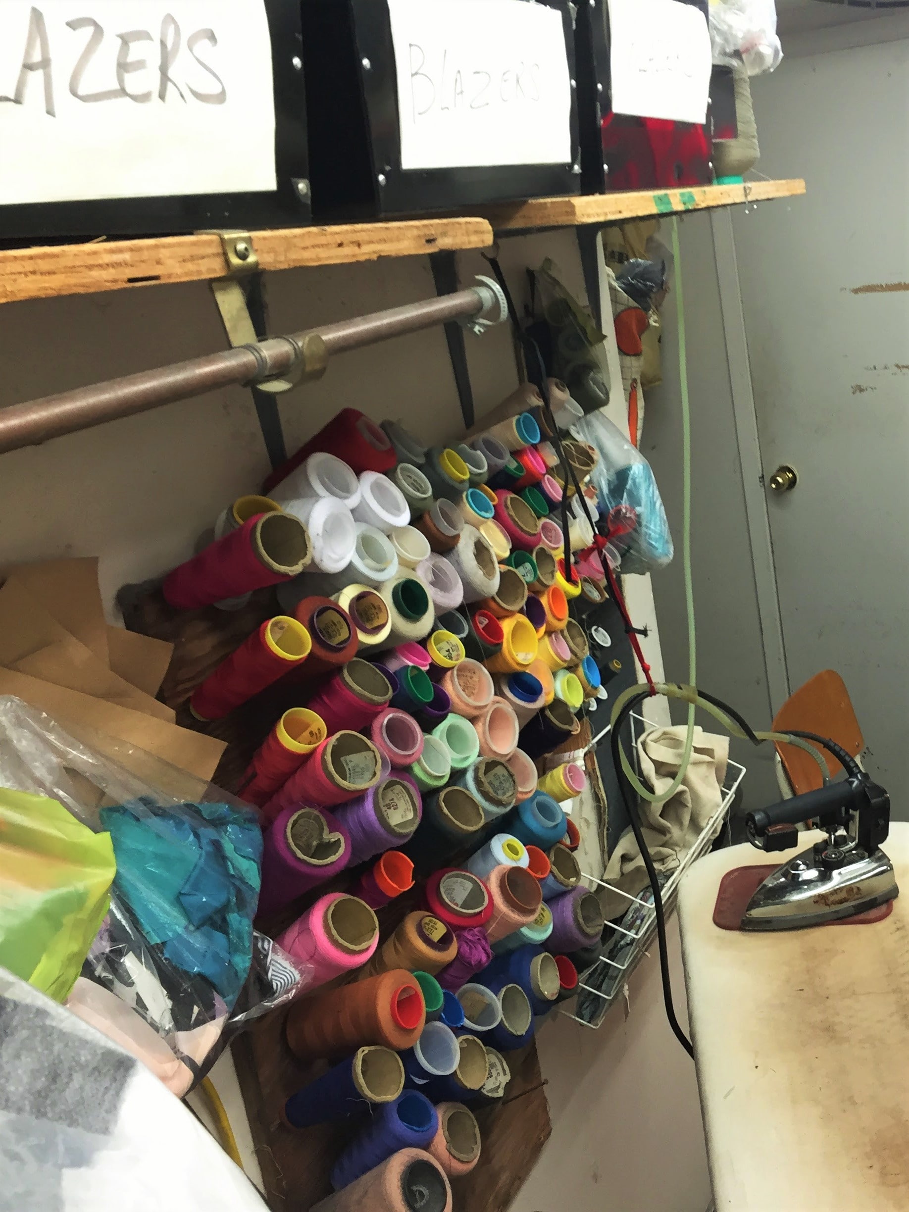Photo of Spools of thread next to the ironing board